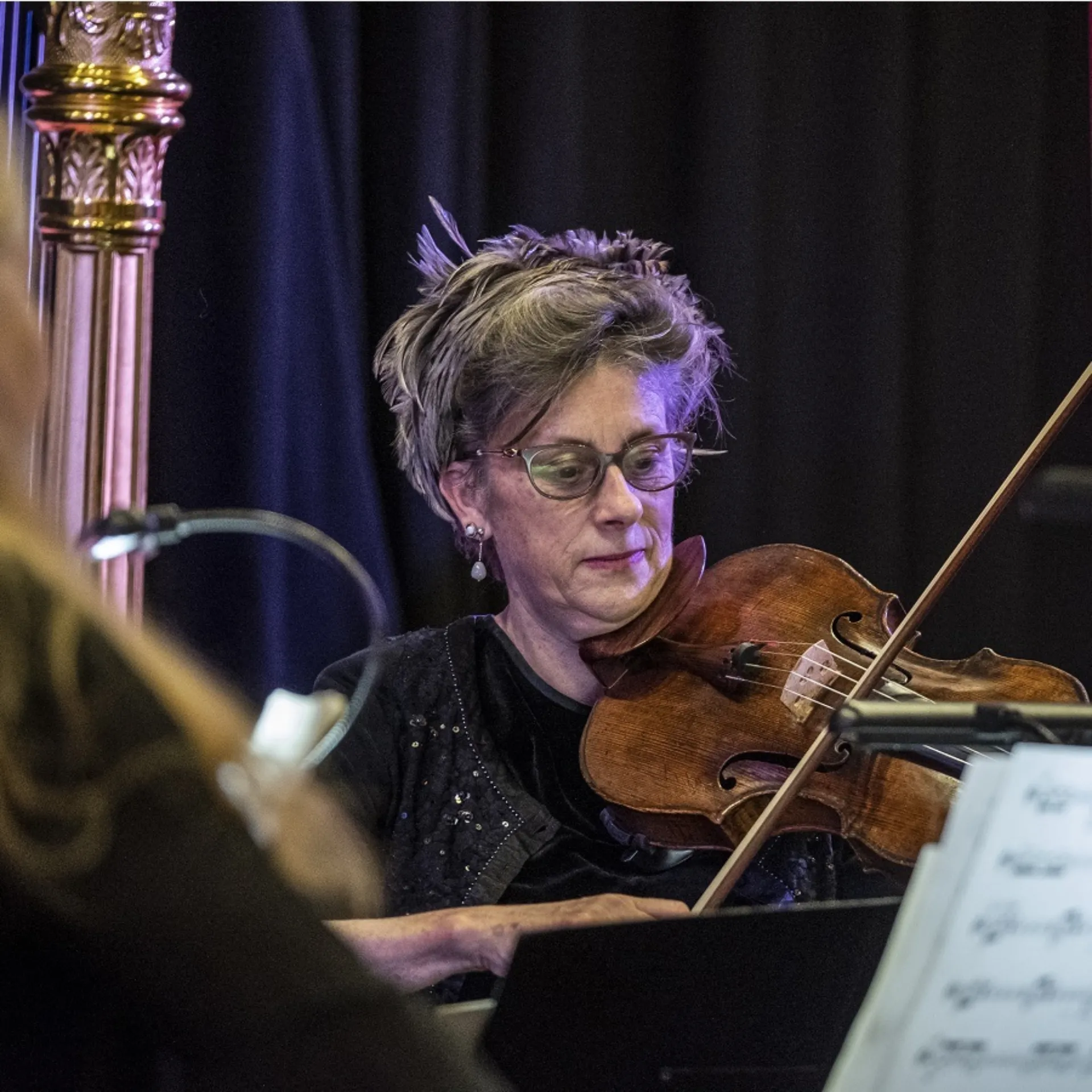 A woman playing the viola