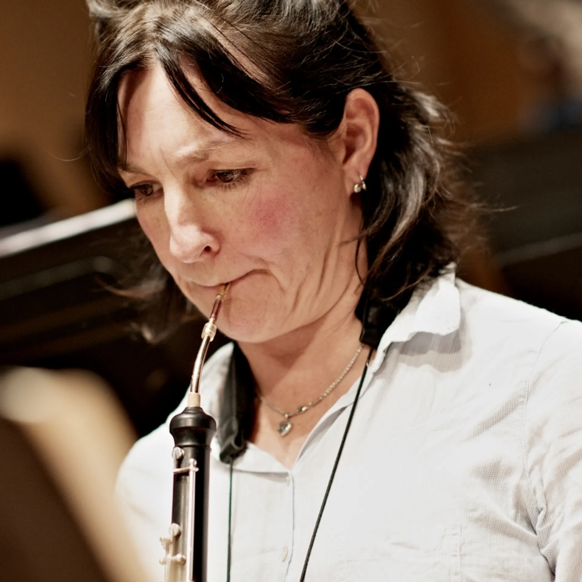 A woman playing the oboe